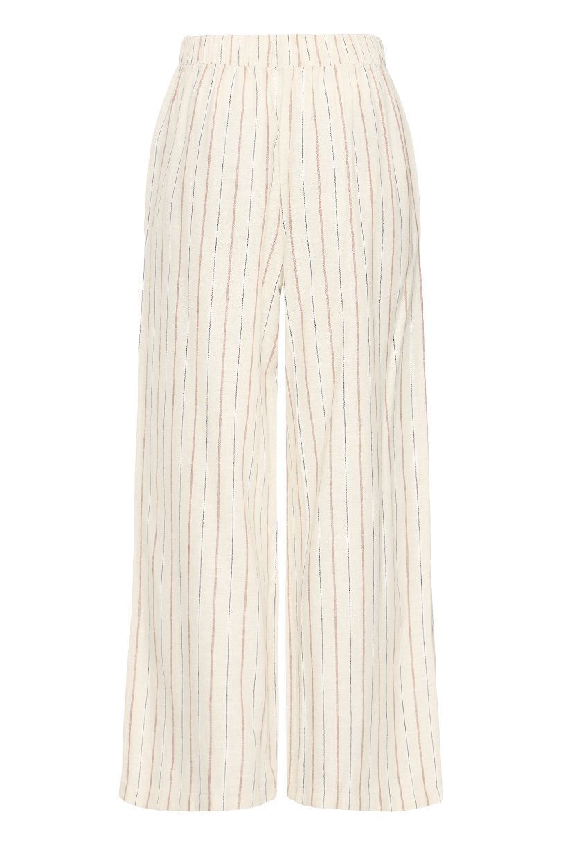 PANTALON LINNO PIEDS NUS SUR LA PLAGE