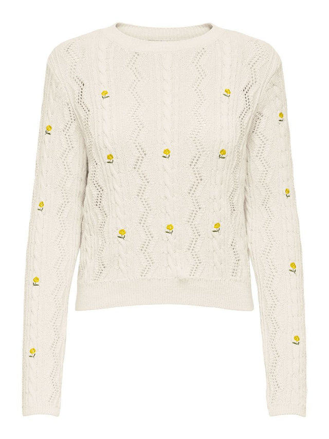 PULL RITA ENTOURÉE DE GAZANIAS