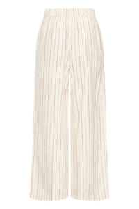 PANTALON LINNO PIEDS NUS SUR LA PLAGE