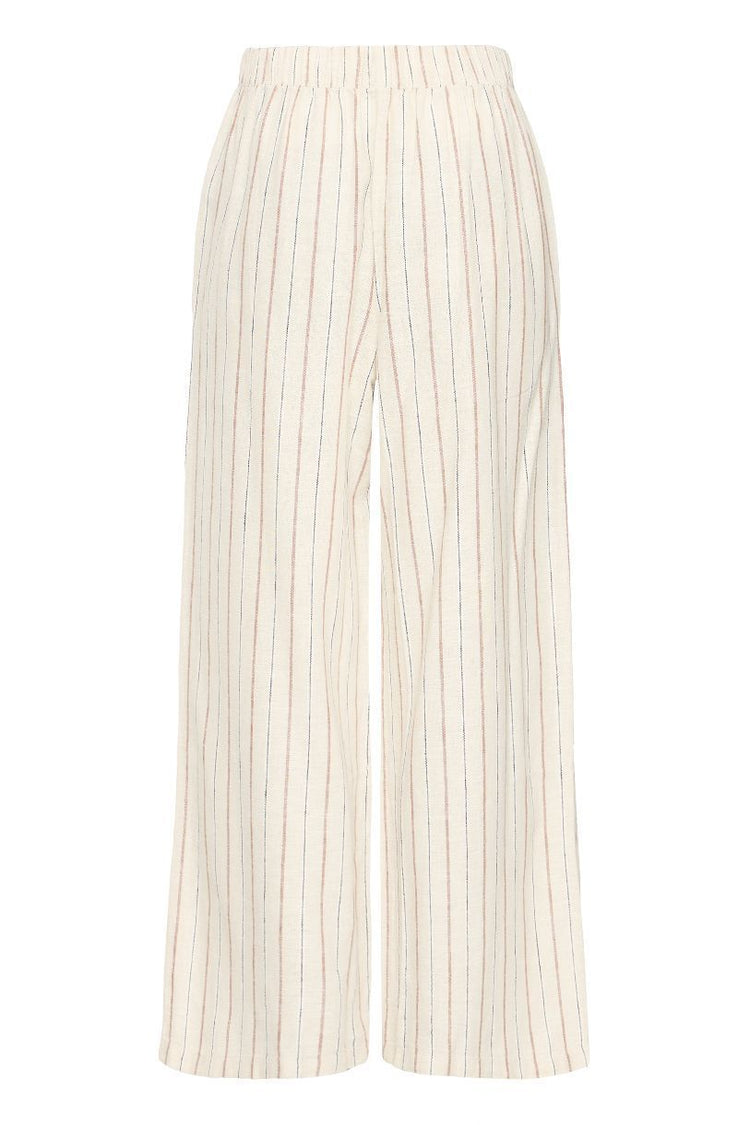 PANTALON LINNO PIEDS NUS SUR LA PLAGE